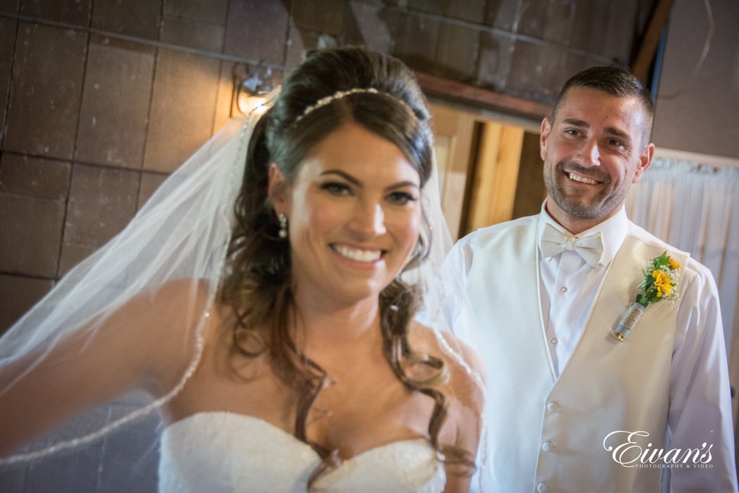 The groom beams as he first sees his ravishing bride for the first time on their wedding day.