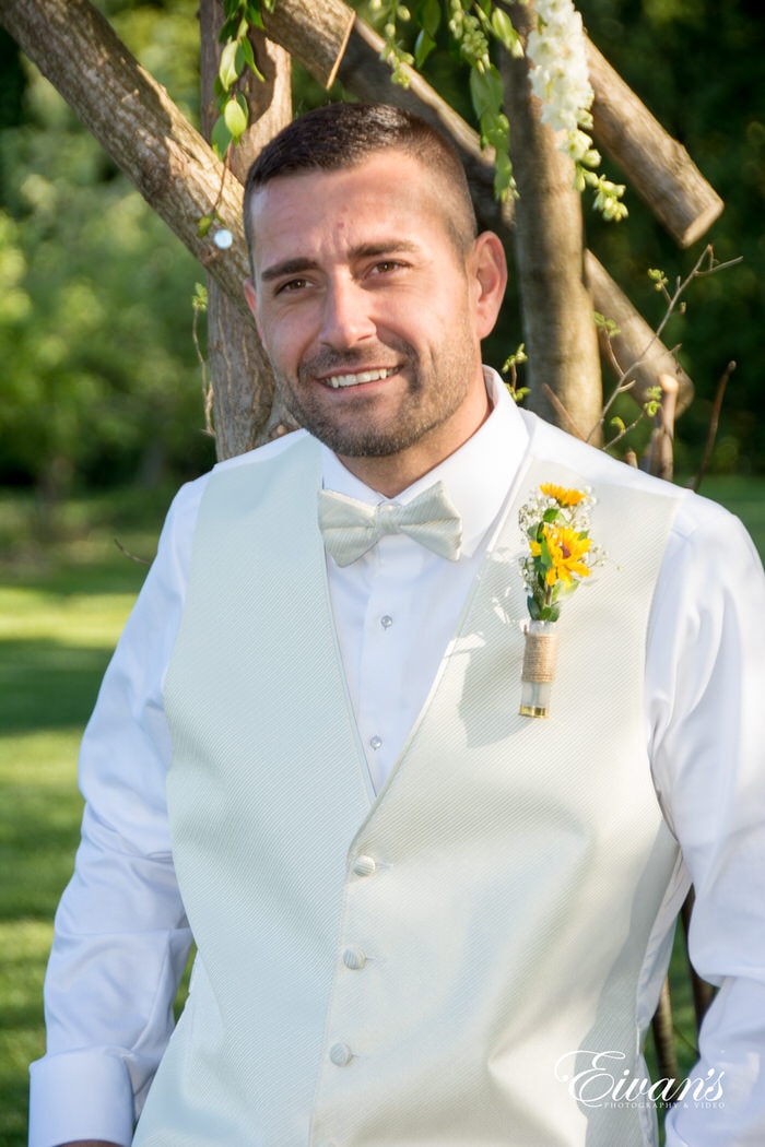 The groom smiles excitedly as he is happy with the most amazing moments he has ever experienced thus far.