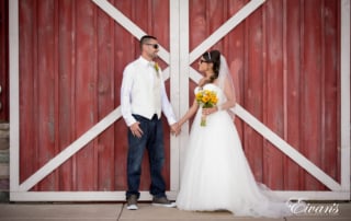 This rustic barn helps complete this couples homey themed wedding while they gaze ever so effortlessly into one another's dreamy eyes.