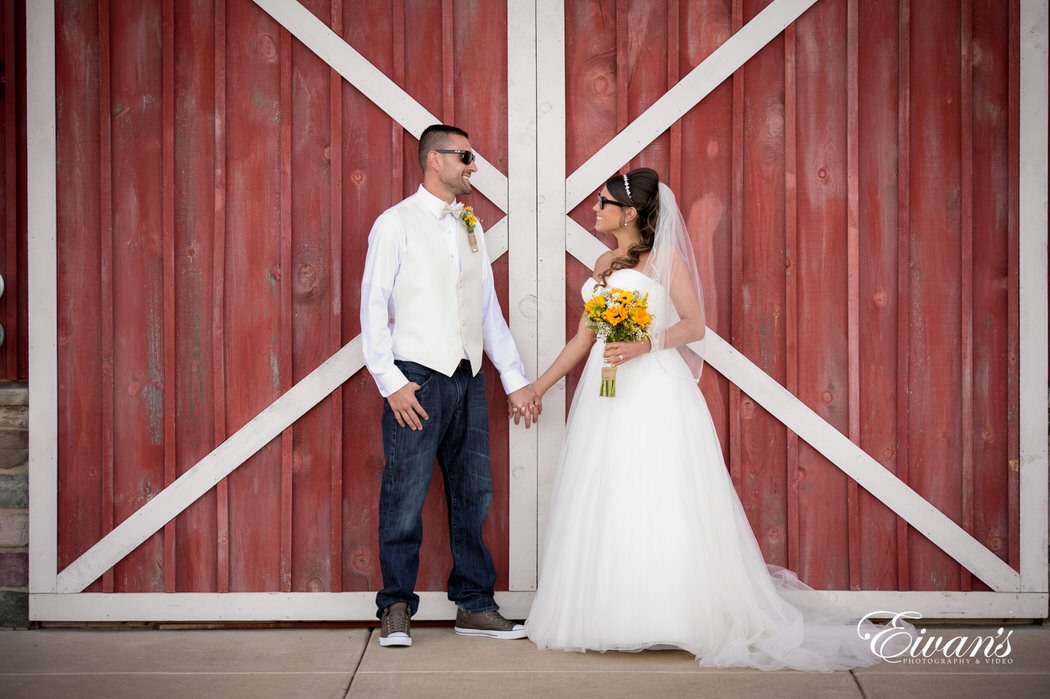 This rustic barn helps complete this couples homey themed wedding while they gaze ever so effortlessly into one another's dreamy eyes.