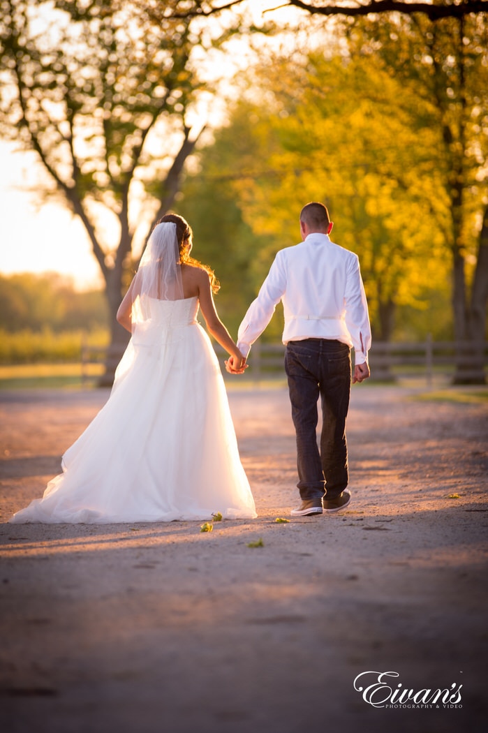 Walking so elegantly while the sunsets on this couple's perfect day only true love and pure happiness fill the air.