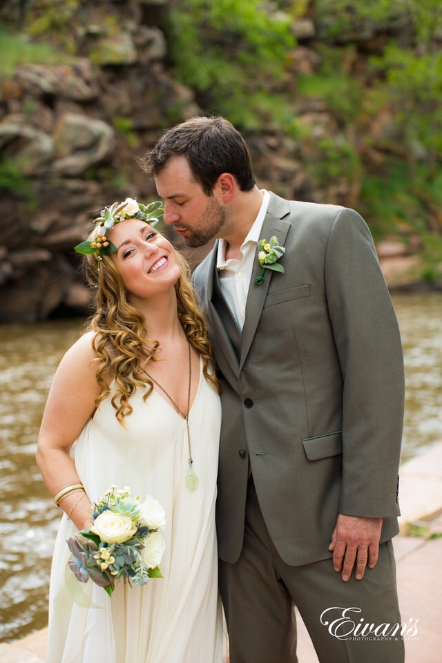 man in gray suit and woman in white wedding dress