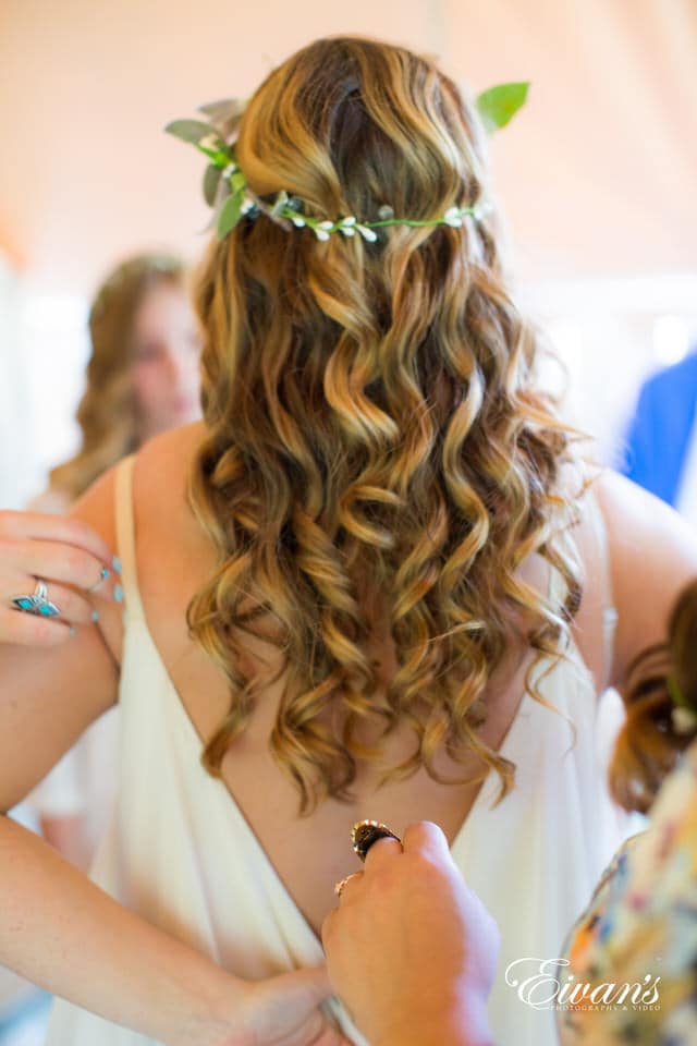 woman in white sleeveless top wearing silver ring