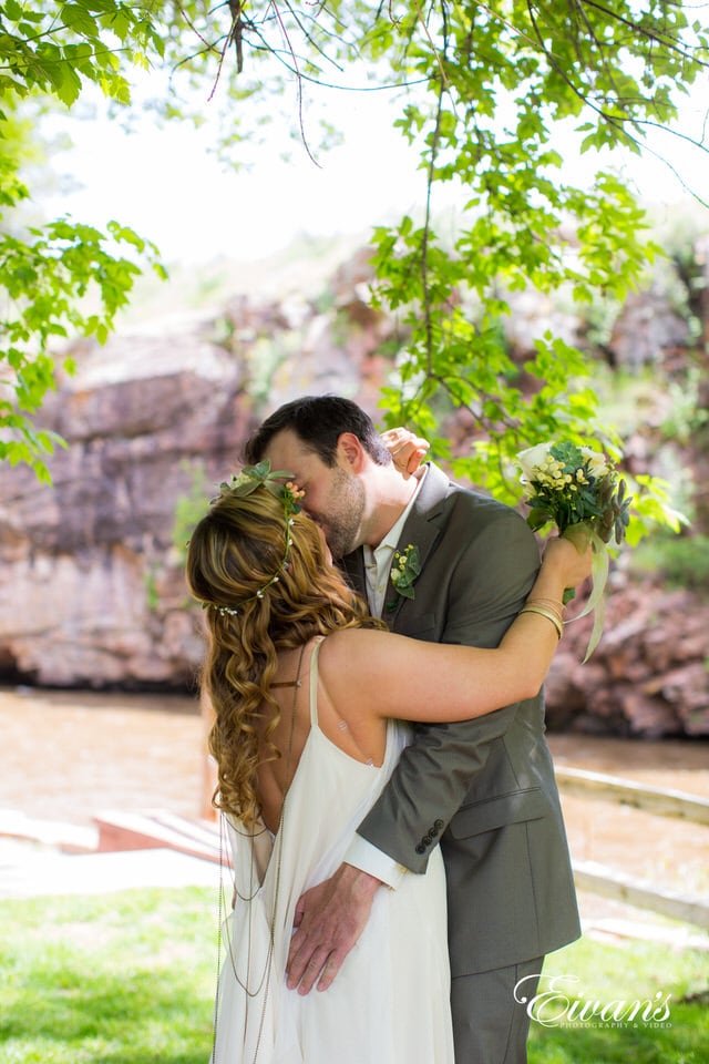 man and woman kissing during daytime