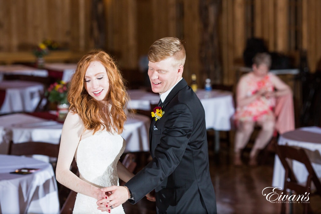 During this first dance the couple gaze around the room in the moment of love and happiness.