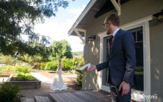 In a picture perfect moment from a fairytale itself while the groom holds his bride's shoes.