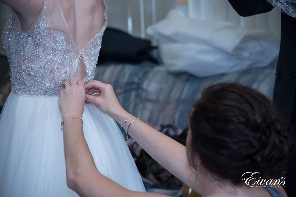 The beautiful and complex beading intricately placed on the top of the dress.