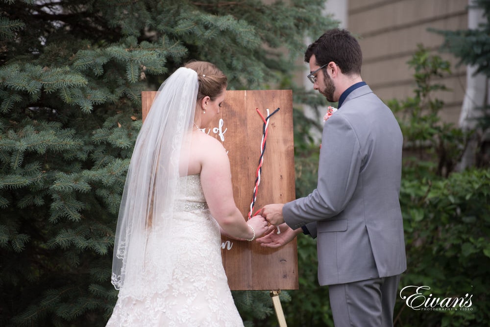 This couple literally tie the knot at their nature ceremony.