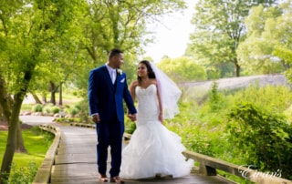 The couple walk together down a beautiful walk way in such an amazing environmental wonder.