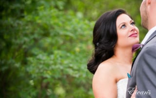 The bride gazes into her groom's eyes falling in love all over again.