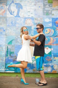 Debra & Alex 4/28/18 A fun, beach-ready couple playfully pose for portrait style engagement photography.