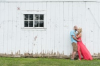 Melissa & Pat 9/9/17 A newly engaged couple looking adoringly at one another in front of an old, rustic barn.