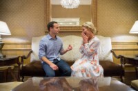 Taylor & Steven 5/5/18 A man proposes to his girlfriend in a beautiful, old-fashioned room. The woman looks at him with excitement in her eyes and covers her mouth with her hands.