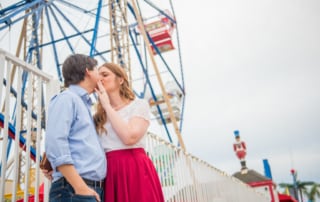 man and woman standing on bridge during daytime