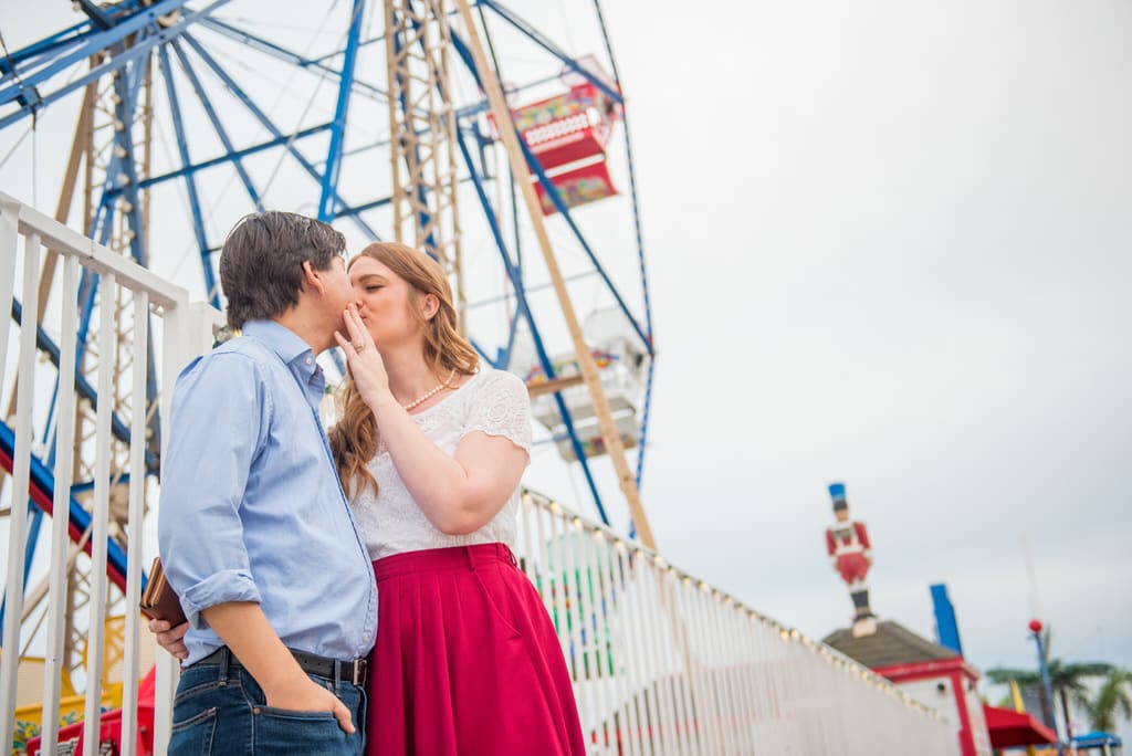 man and woman standing on bridge during daytime