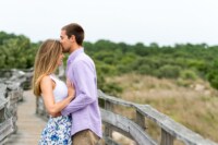 Jennifer Shane This lovey couple celebrated their gorgeous engagement session by cascading down a natural wood bridge. Their radiating smiles only truly demonstrate just how in love this soon-to-be married couple is. The outstanding beach scene entirely encompasses everything that they will want in their life.