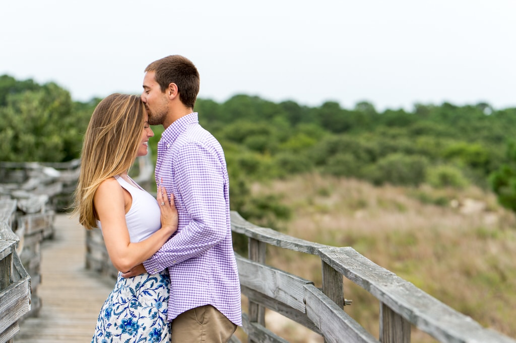 This lovey couple celebrated their gorgeous engagement session by cascading down a natural wood bridge. Their radiating smiles only truly demonstrate just how in love this soon-to-be married couple is. The outstanding beach scene entirely encompasses everything that they will want in their life.