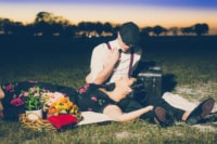 Wedding / Engagement Photography The vintage looks worn by this couple truly encompasses their particular style. To help truly capture this antique look the couple had old film cameras and beautiful flowers.