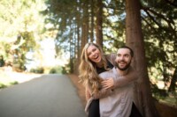 Katie Chris The gorgeous woods and even more stunning couple celebrate their never ending love while the soon-to-be groom carried his fiance on his back while they smile and laugh their worries away.