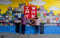 eivans_gallery_engagement_photos_149 The intense artwork painted on this wall is super bright which entirely captures how beautiful this couple's relationship is and how colorful this relationship is.
