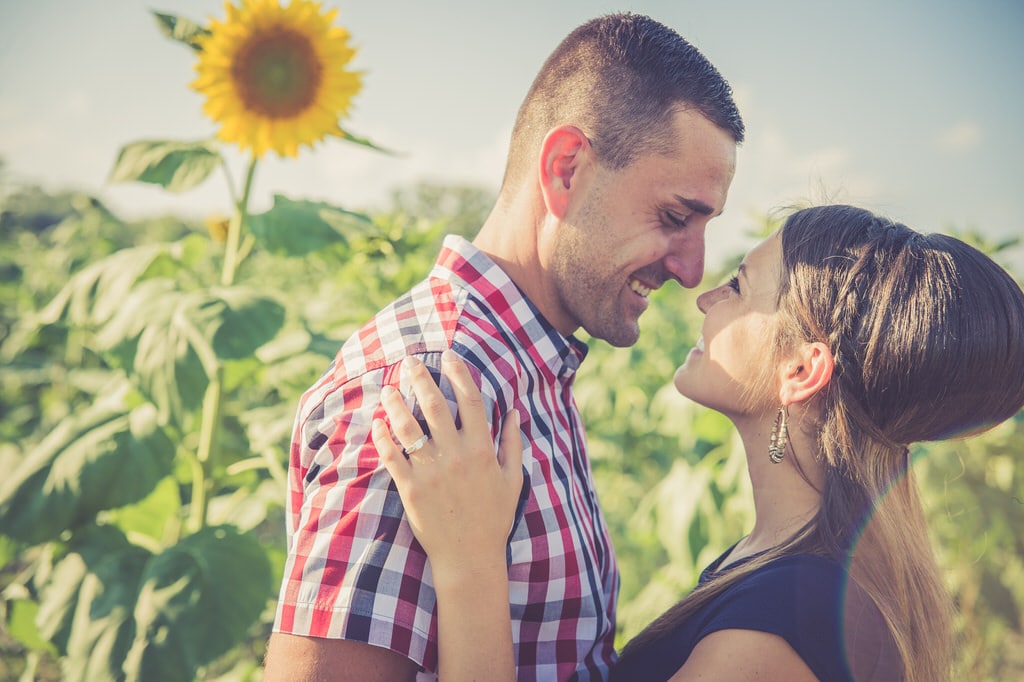 The bright yellow sunflowers and vibrant sun flares help encompass the beaming happiness this couple is feeling while they take their gorgeous engagement photos. The stunning smiles the couple have really show you just how much this couple loves one another.