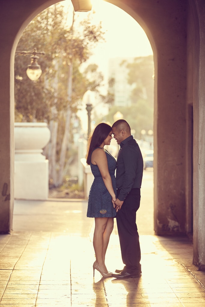 This beautiful stone arch helps break up the gorgeous scenery and the bright yellow sun while this couple smiles and holds one another. Wholesome love completely describing the emotions flowing through this couple.