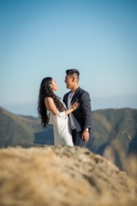 Sheila & Jef 5/5/18 The photographer captures a gorgeous candid shot of a young newly engaged couple laughing and smiling at one another on a sunny day in the mountains of California.