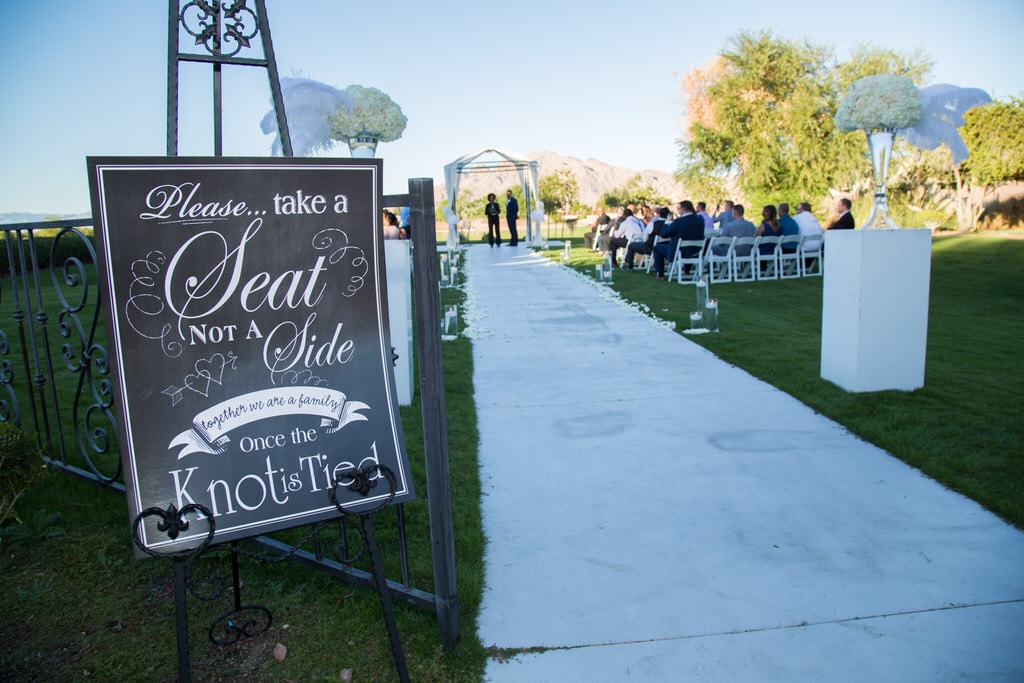 Eivan's Photographer captures the entryway sign indicating that wedding guests should take a seat and not a side.