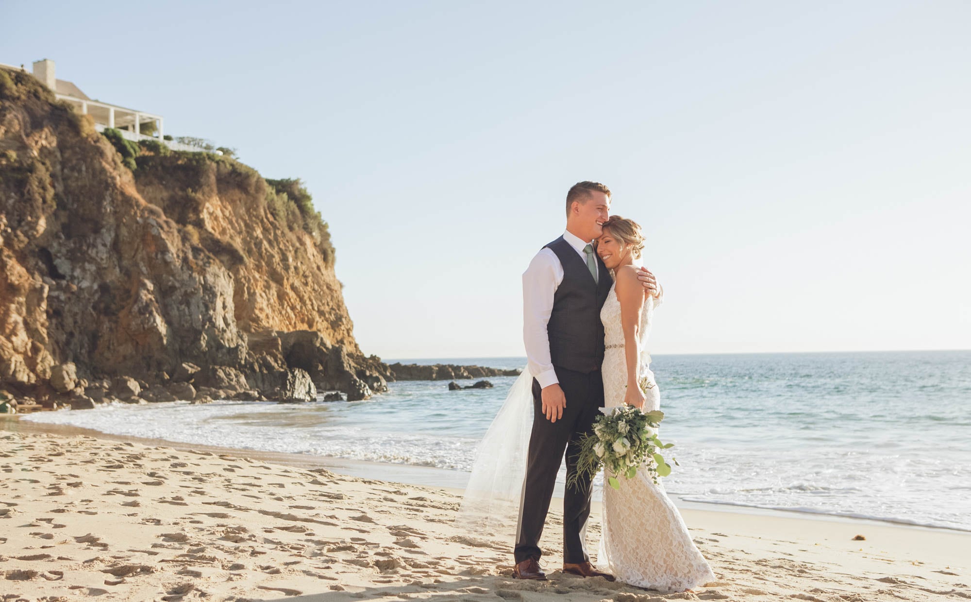 newlyweds in love on the beach, photographed by Eivan's in Los Angeles