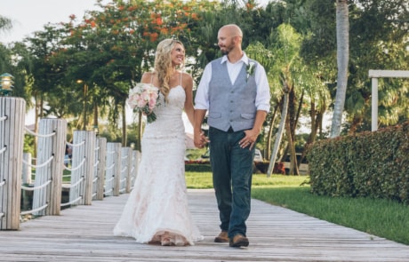 newlyweds walking hand in hand, miami wedding photographer availability