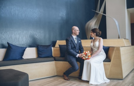newlyweds sitting in a loft, new jersey wedding photographer availability