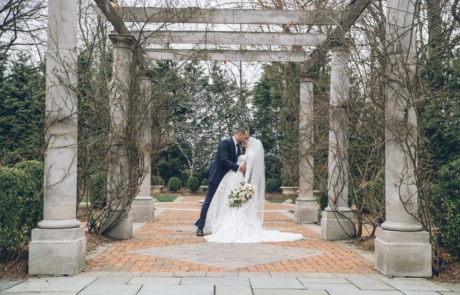 newlyweds kissing in an aisle, new jersey wedding photographer portfolio