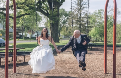 woman in white dress sitting on swing