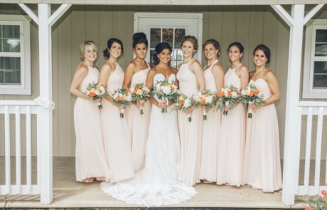 woman in white wedding dress holding bouquet of flowers