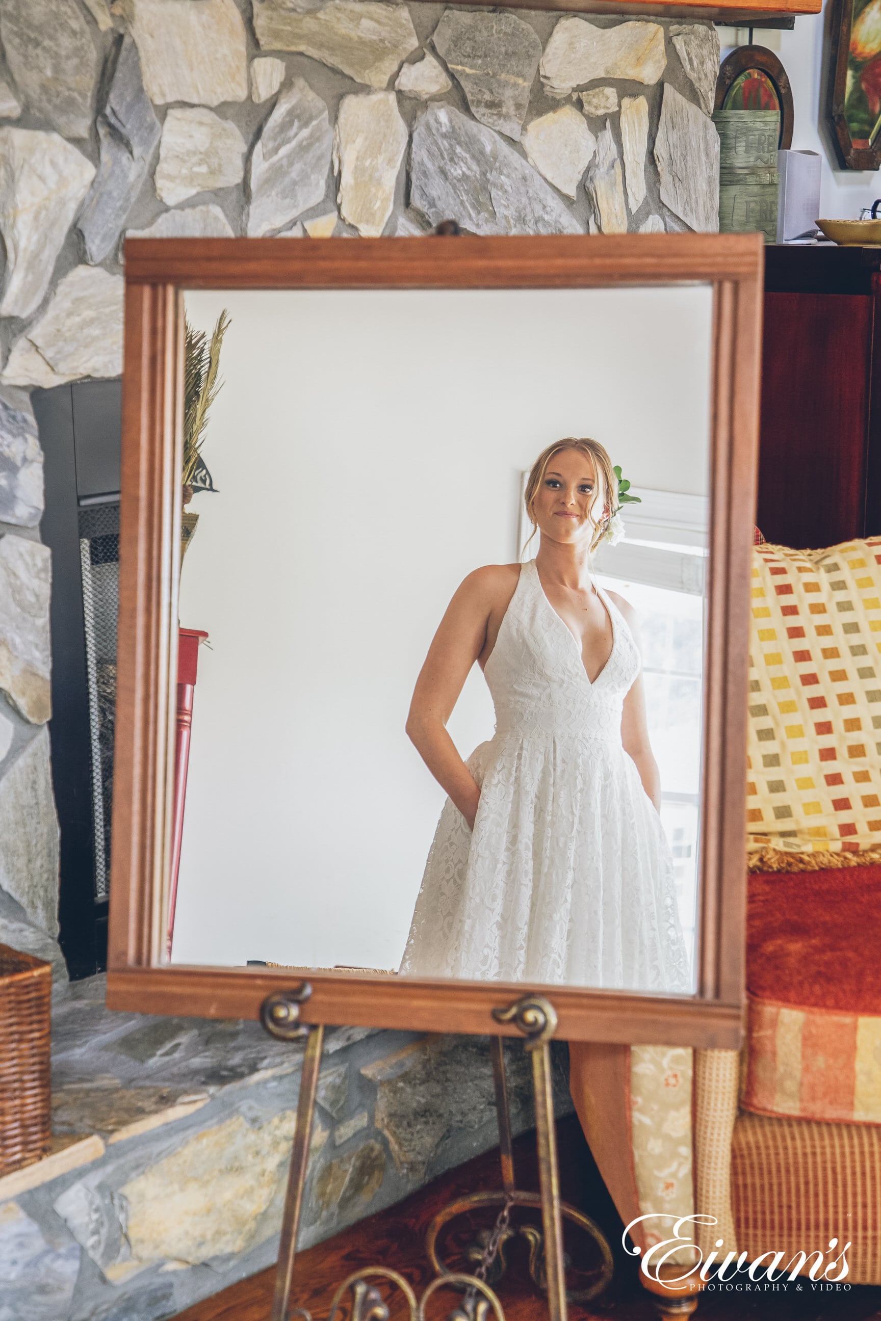 woman in a white dress looking in the mirror