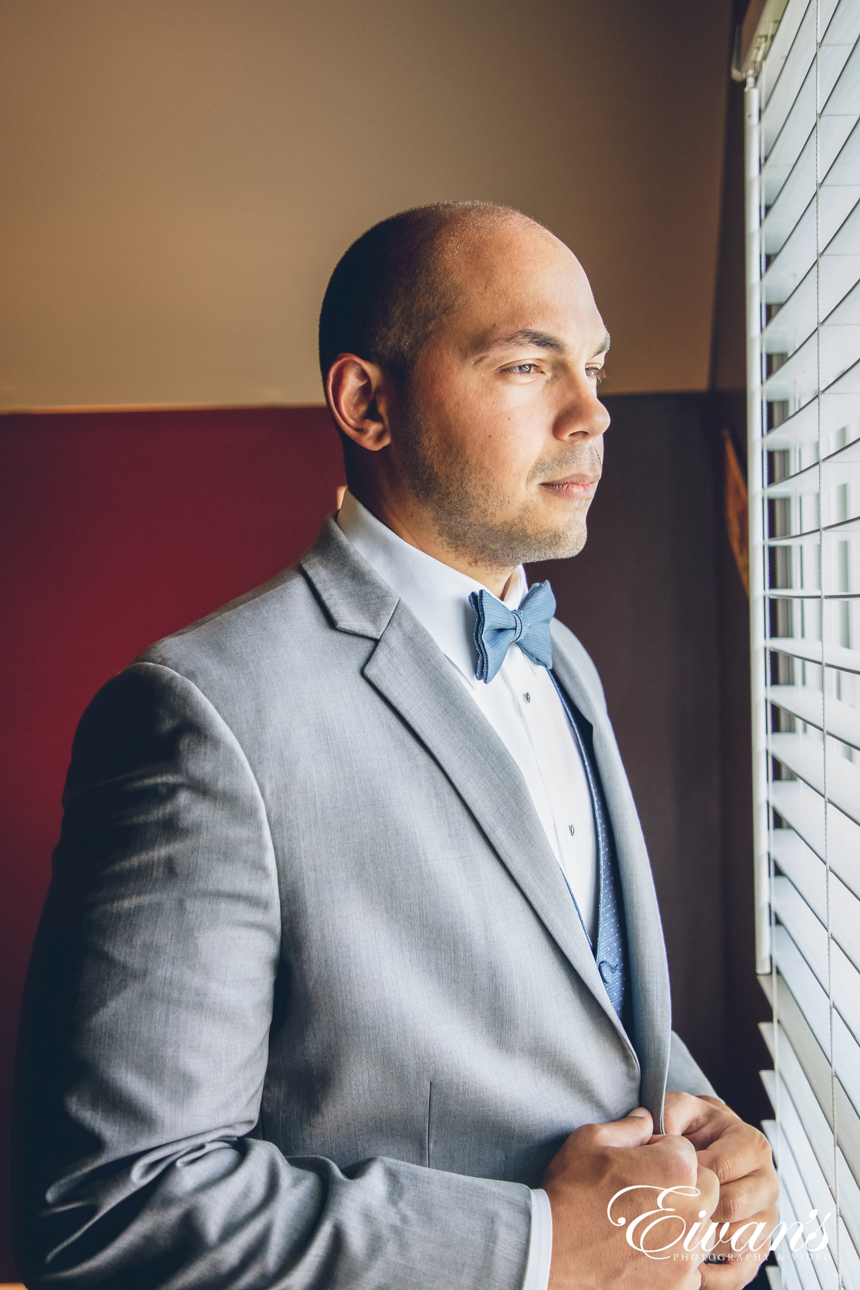 man looking out the window