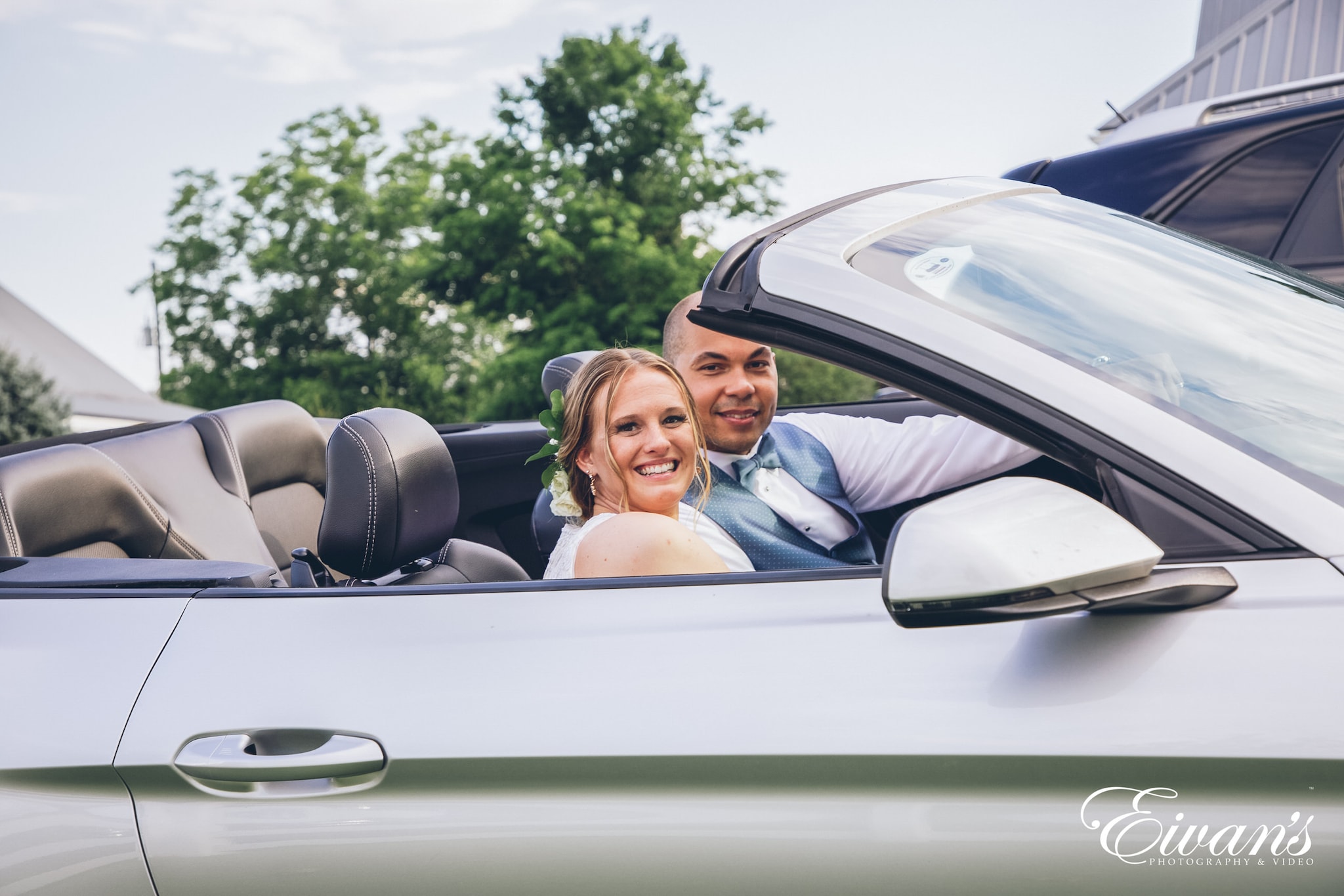 man and woman in a grey car