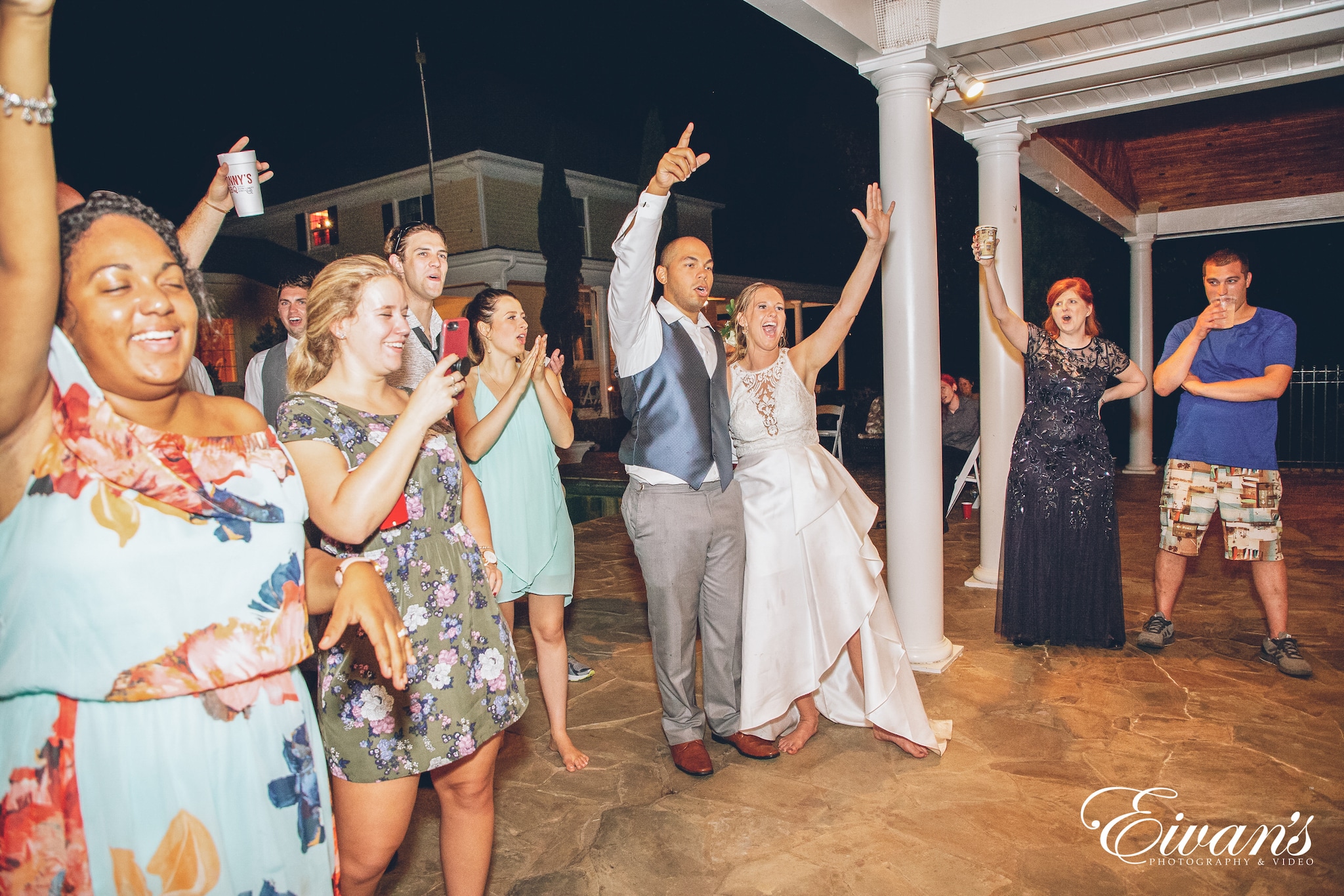 bridal party with hands in the air