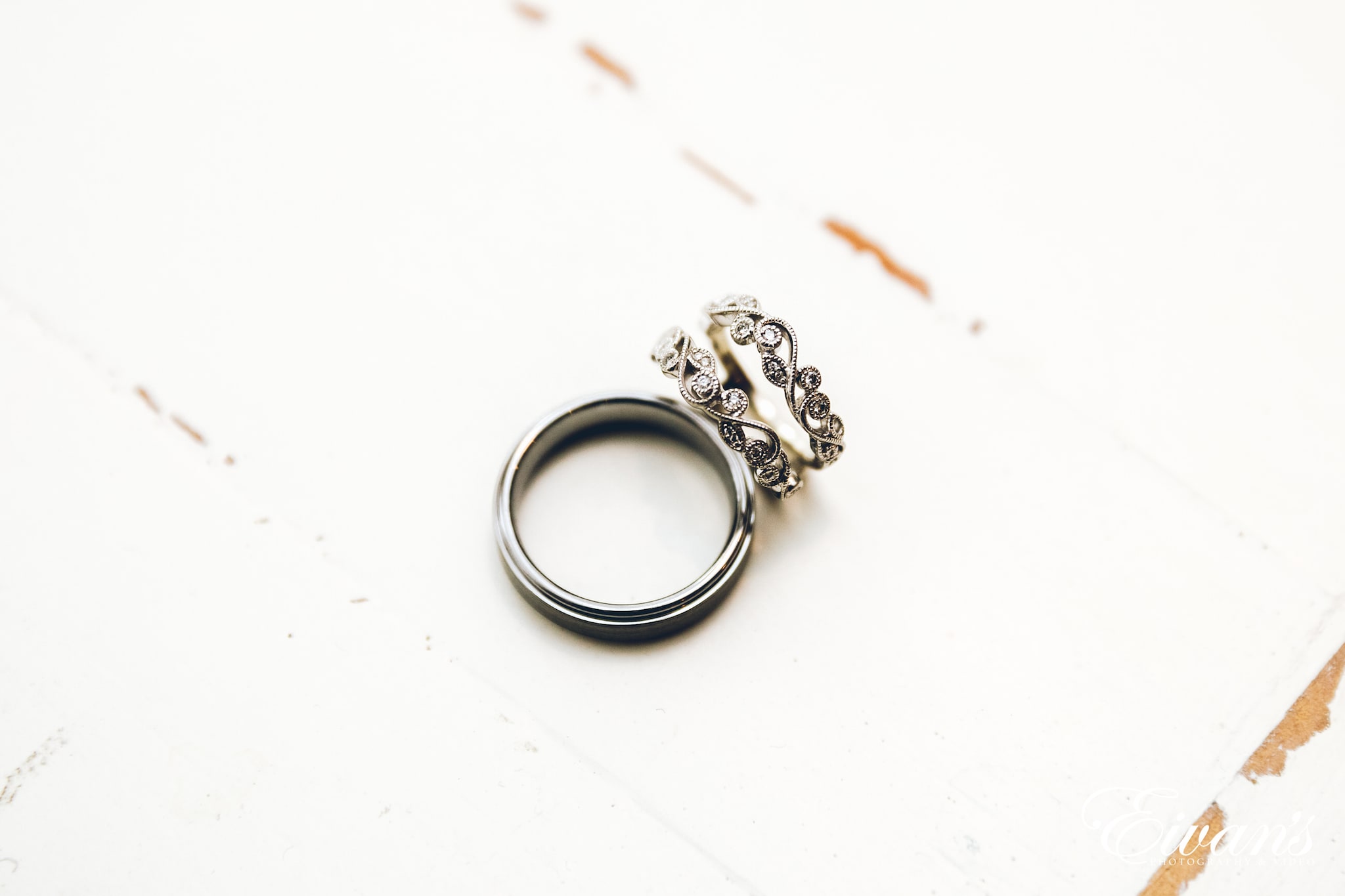 silver ring on white textile