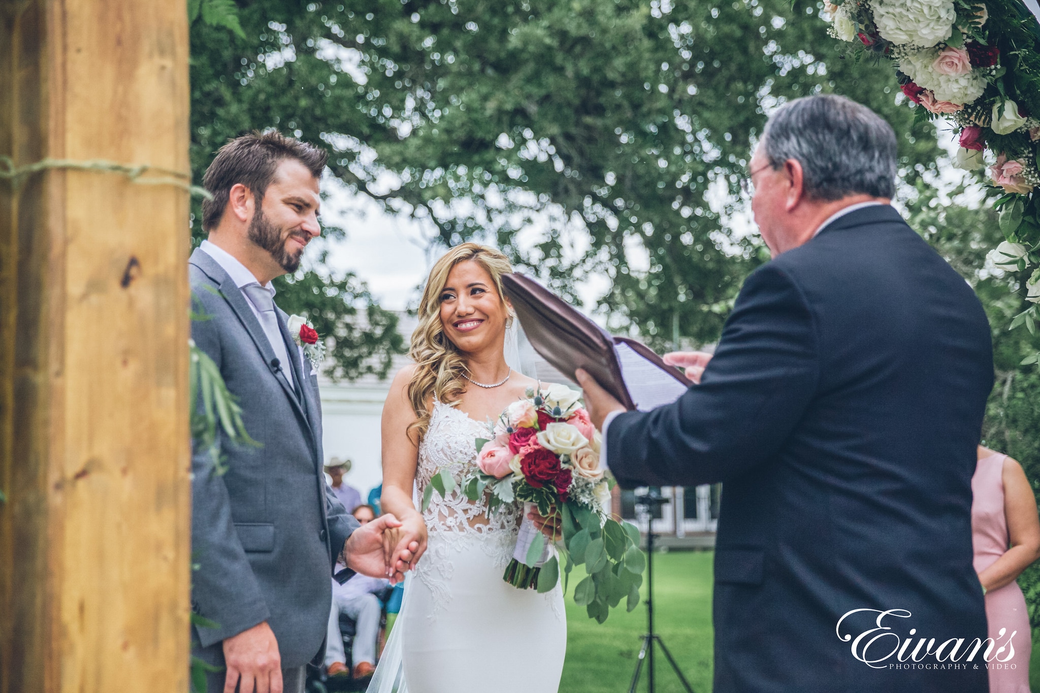 man in black suit jacket and woman in white wedding dress