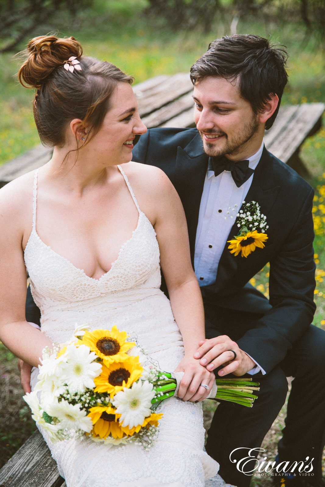 woman in white tank top sitting beside man in black suit jacket