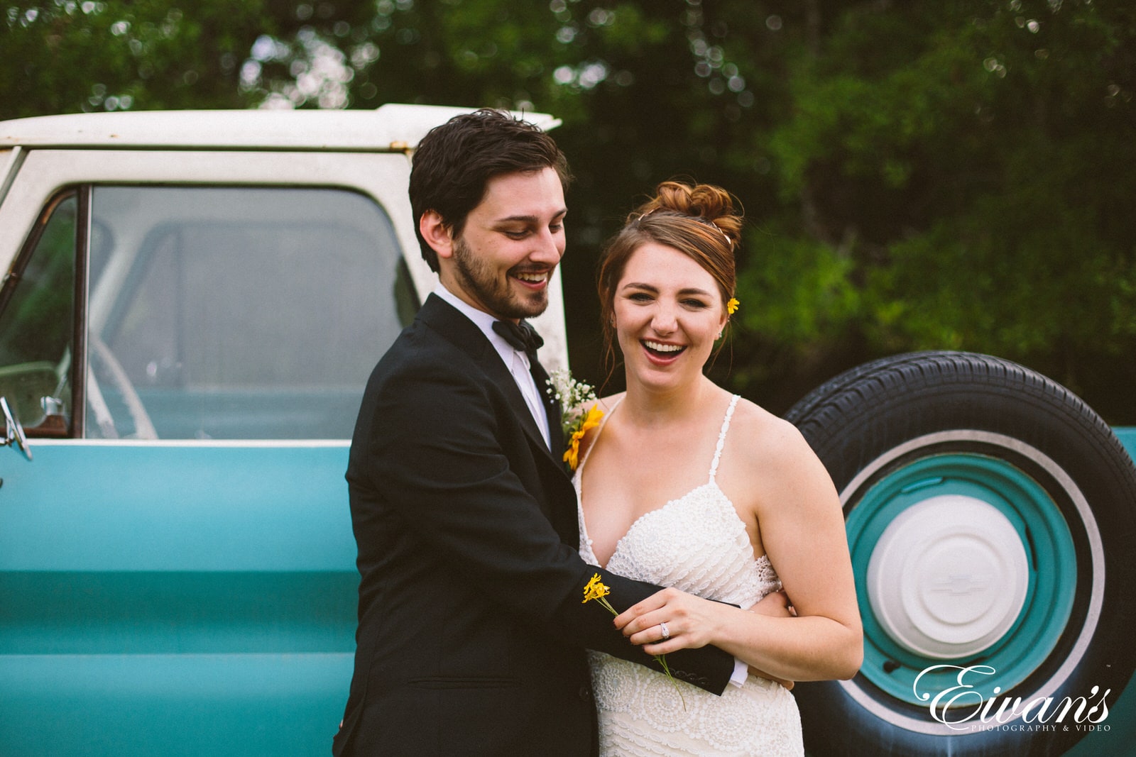 man in black suit jacket and woman in white wedding dress