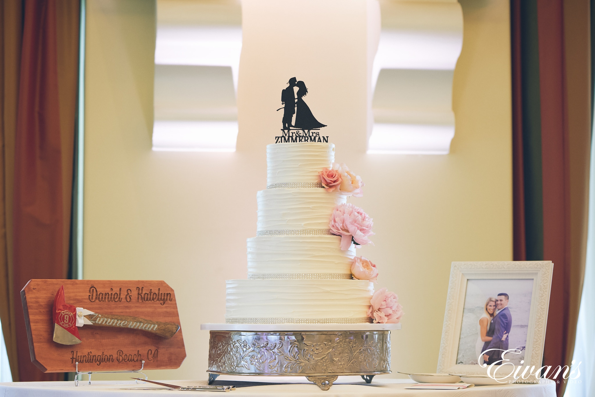 four teared wedding cake, an axe, and a picture frame