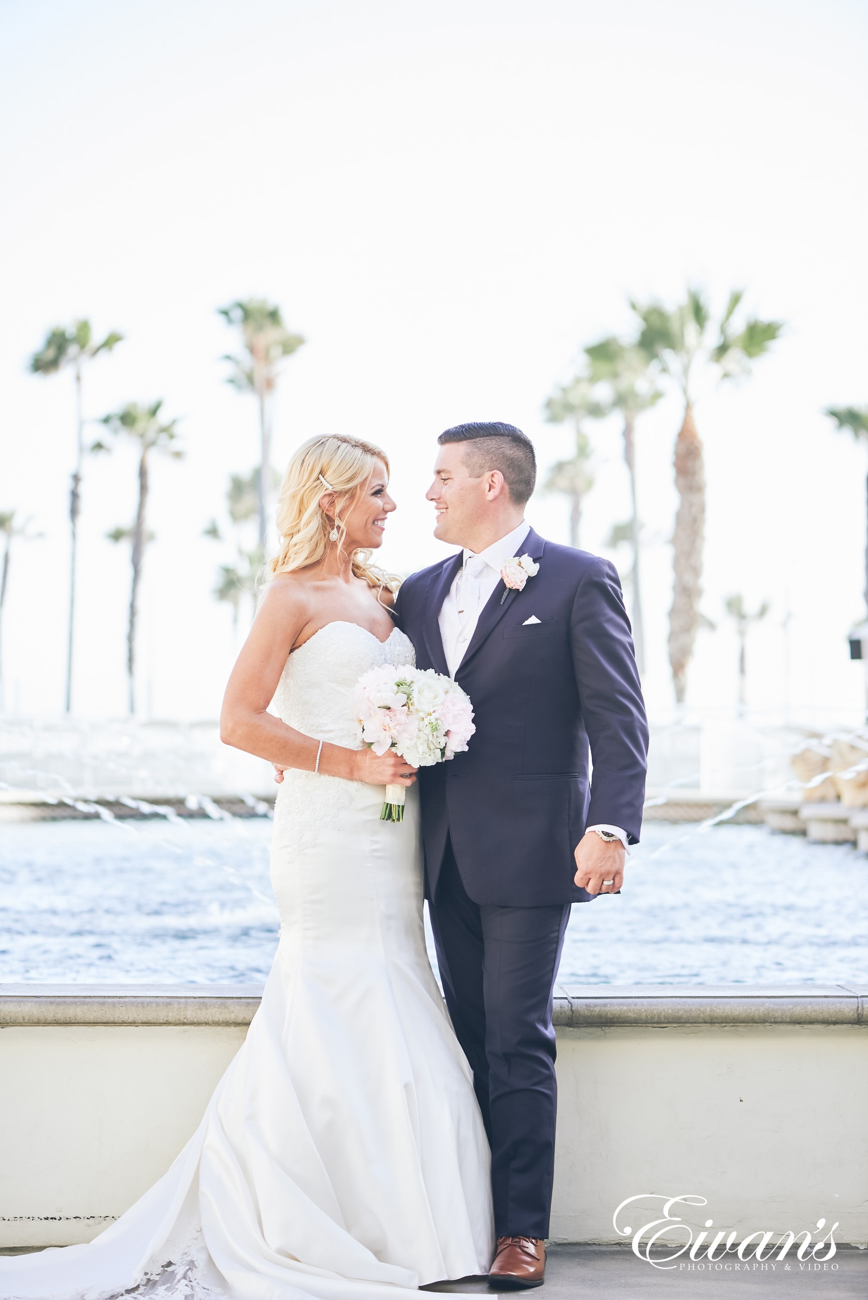 man in black suit and woman in a white dress