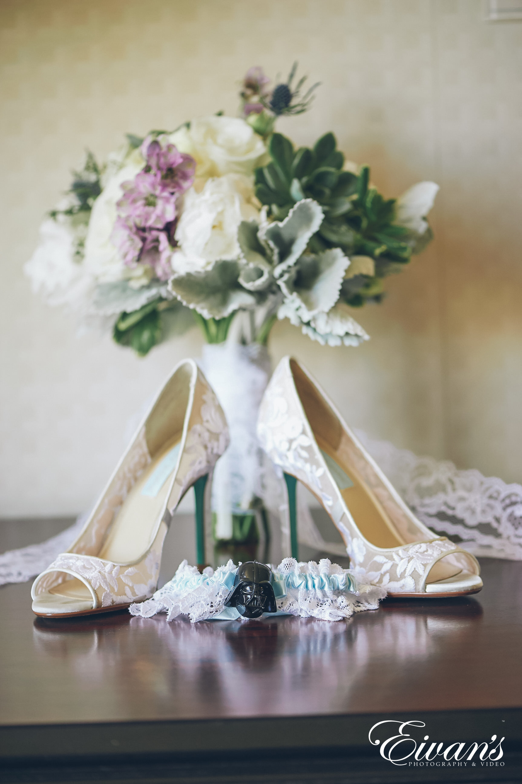 shot of a bouquet with lace shoes and garter