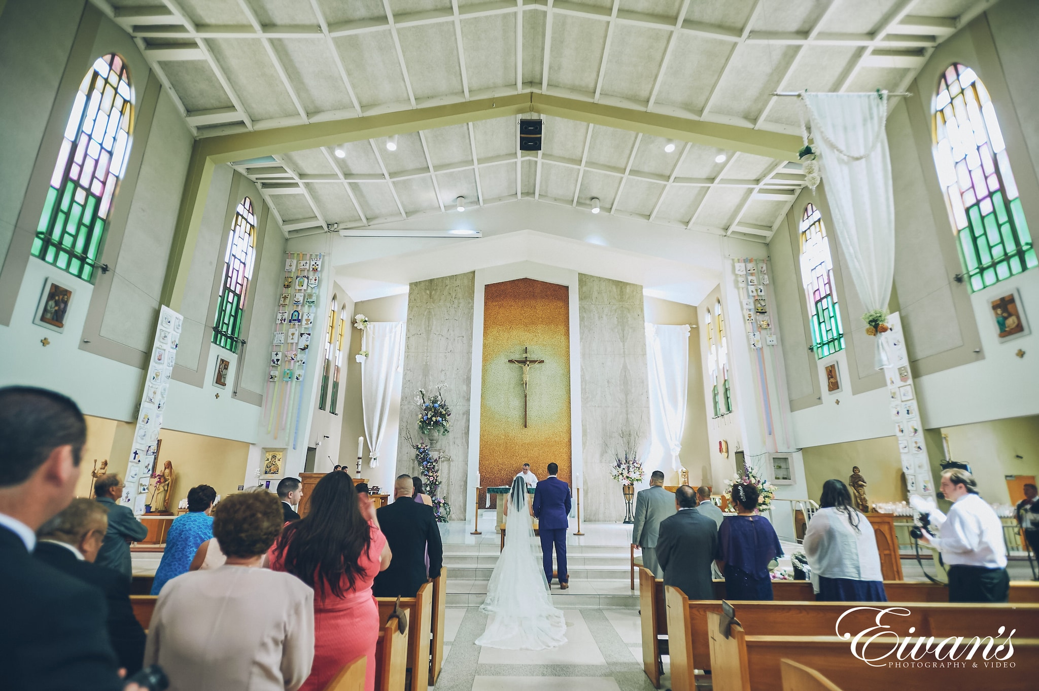 bride and groom at the alter in a church