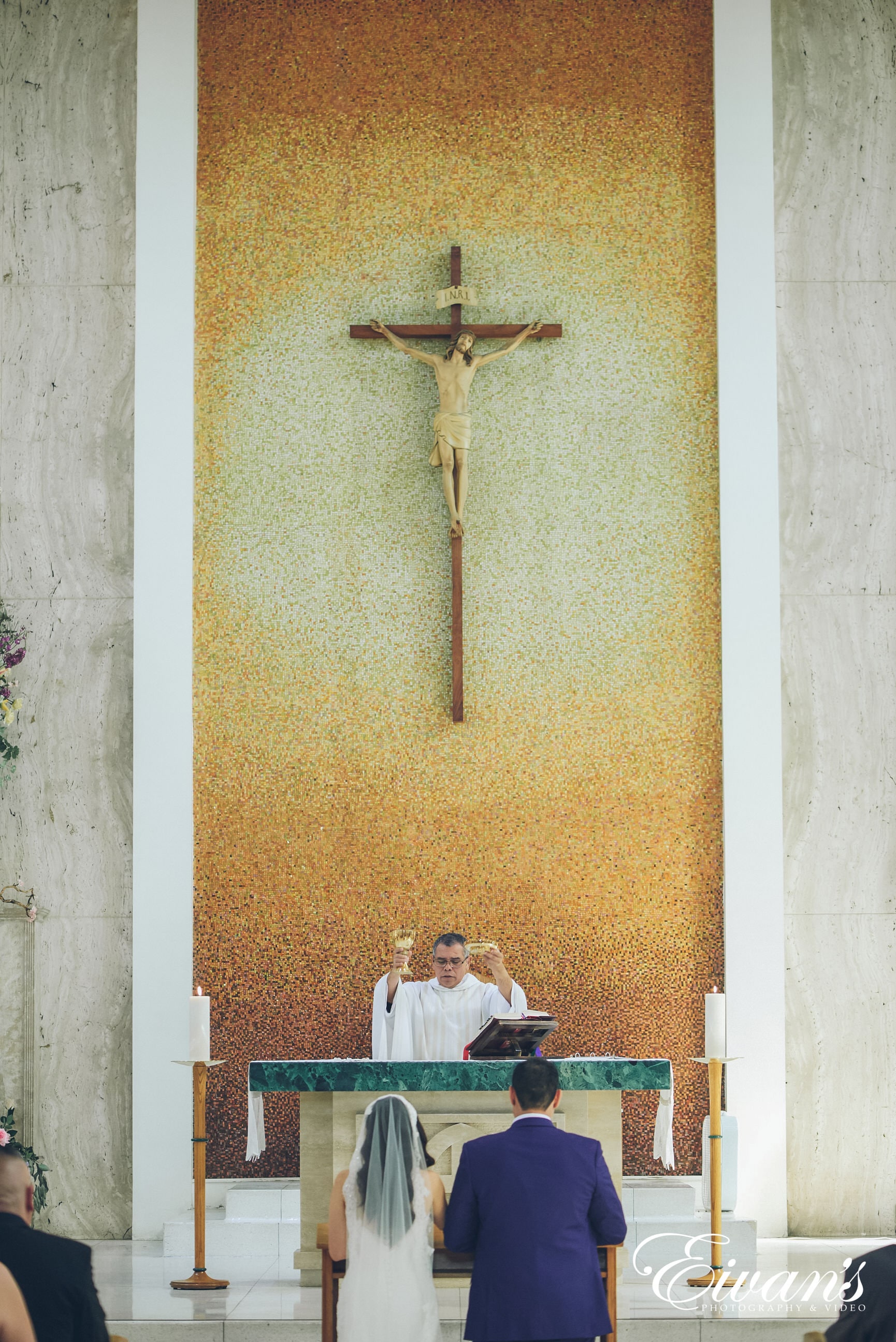 man and woman in front of a priest