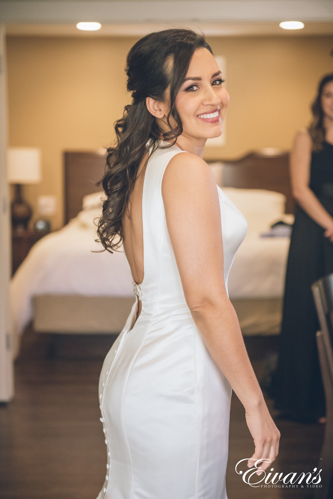 portrait of a woman in a long white dress