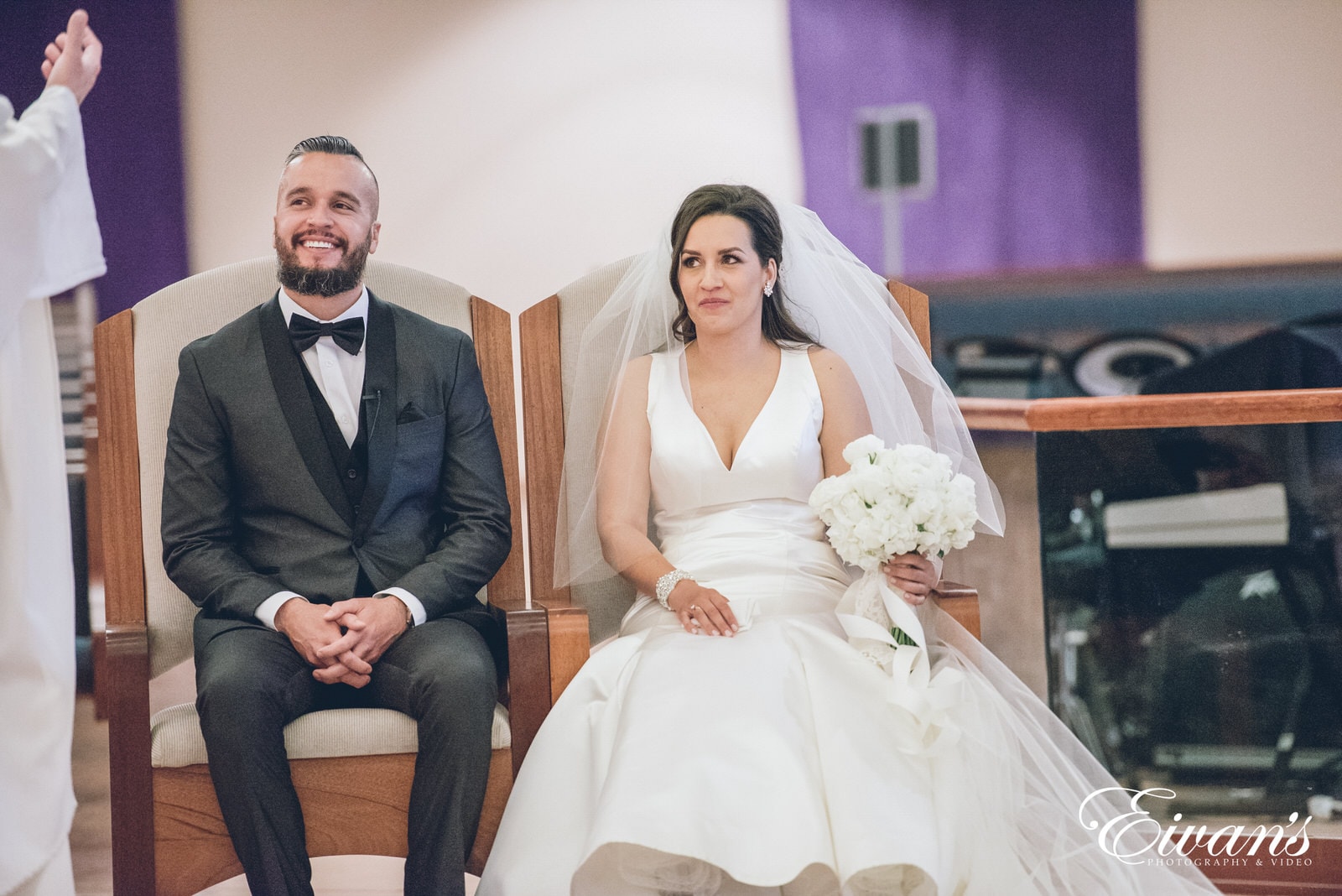 man and woman sitting in chairs