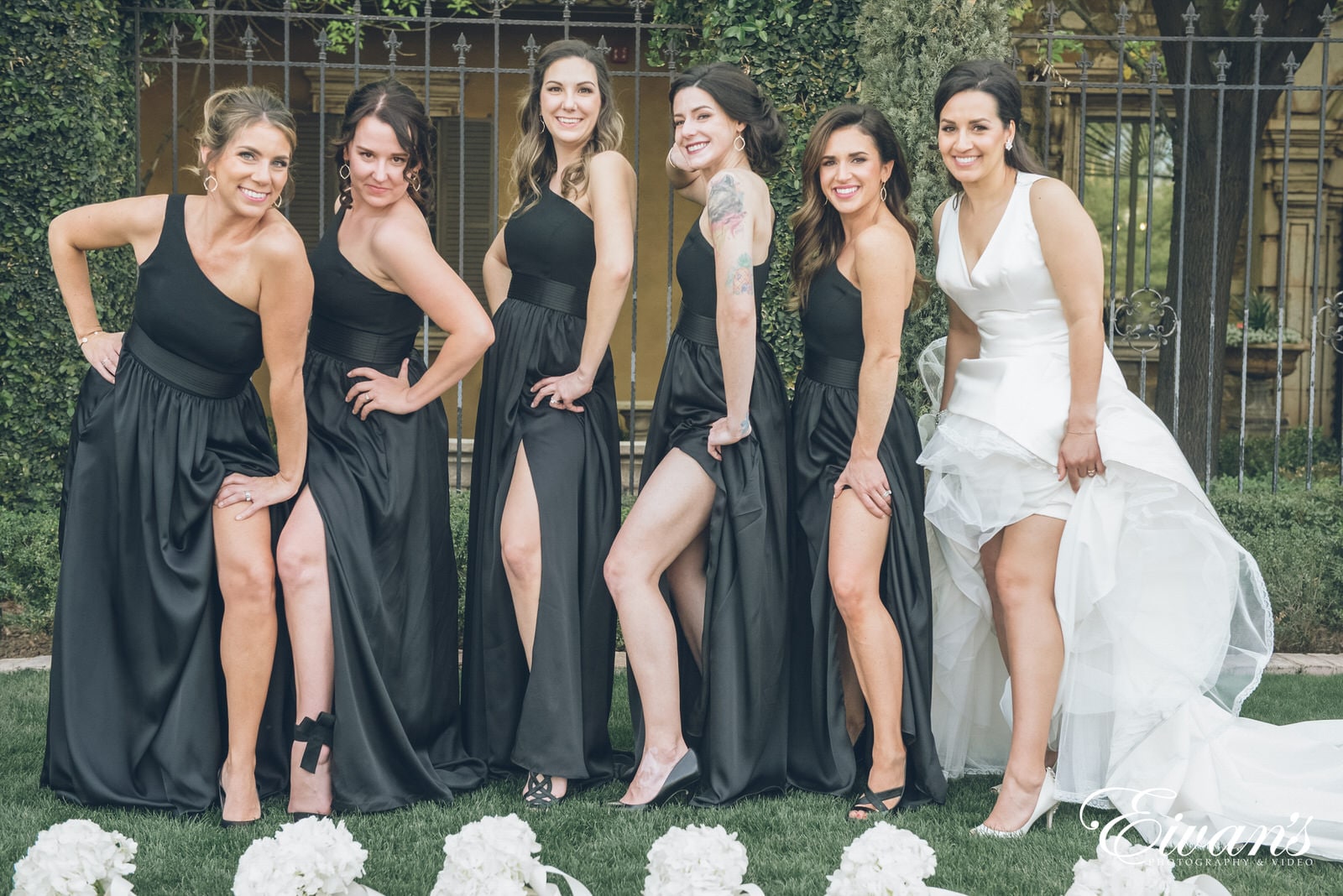 six woman with their dresses up to expose their leg